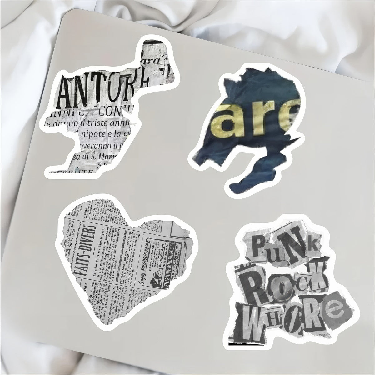 A collection of 52 stickers designed with vintage newspaper prints, old magazine clippings, classical artwork, and muted neutral tones, ideal for decorating journals and scrapbooks.