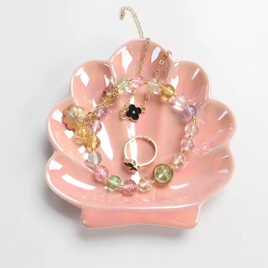 pink and white seashell shaped ceramic jewelry tray