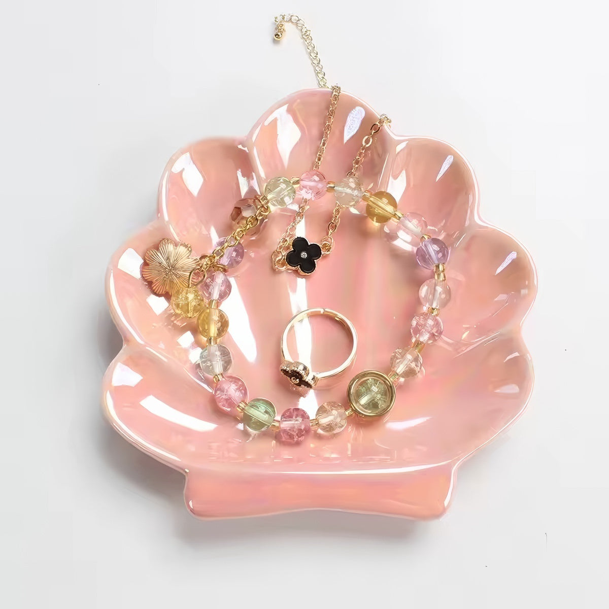 pink and white seashell shaped ceramic jewelry tray