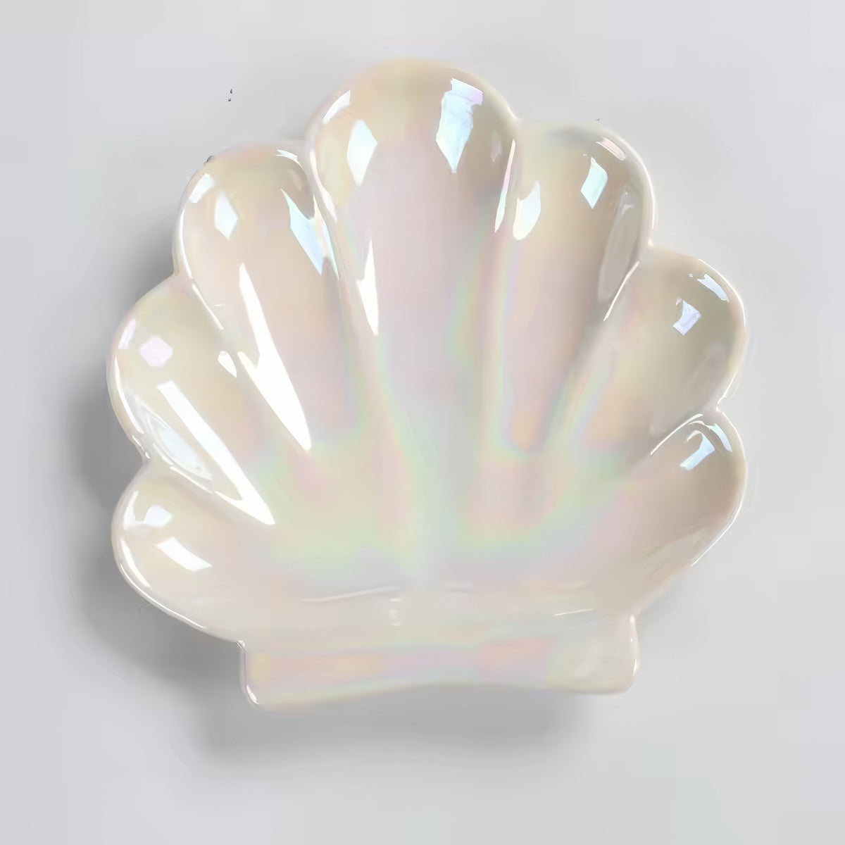 pink and white seashell shaped ceramic jewelry tray