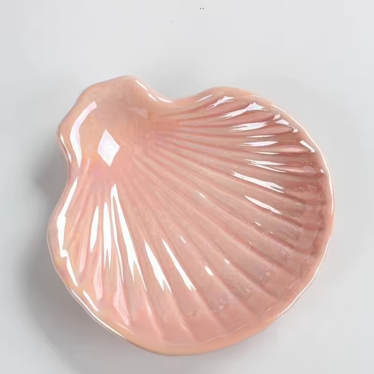 pink and white seashell shaped ceramic jewelry tray