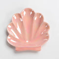 pink and white seashell shaped ceramic jewelry tray