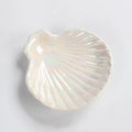 pink and white seashell shaped ceramic jewelry tray