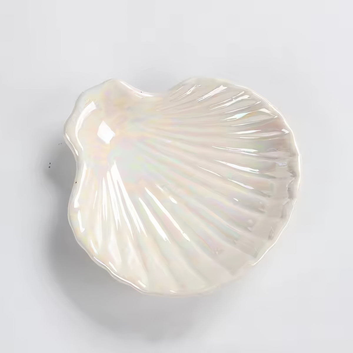 pink and white seashell shaped ceramic jewelry tray