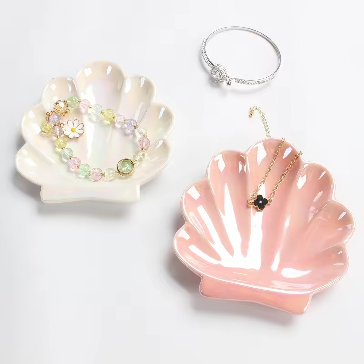 pink and white seashell shaped ceramic jewelry tray
