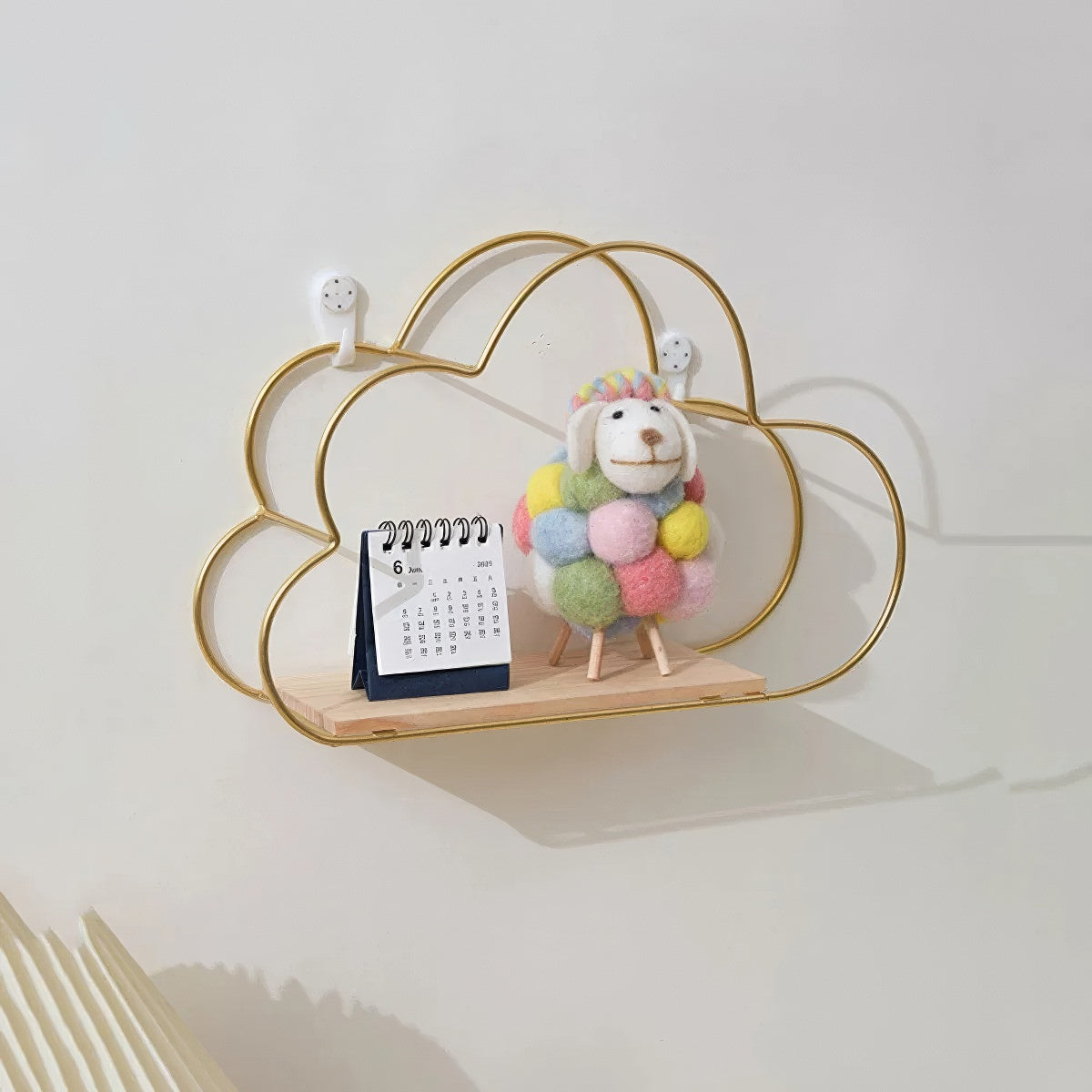cloud shaped wall shelf made of golden frame wire