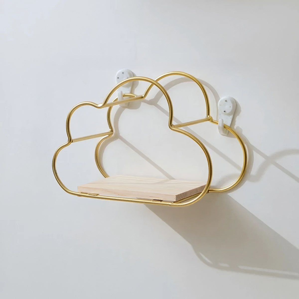 cloud shaped wall shelf made of golden frame wire