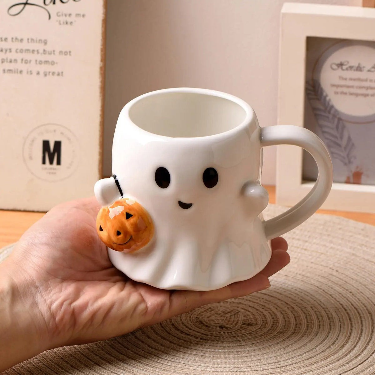 Ghost-shaped mug with a pumpkin halloween aesthetic