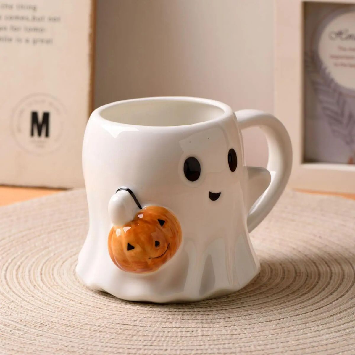 Ghost-shaped mug with a pumpkin halloween aesthetic