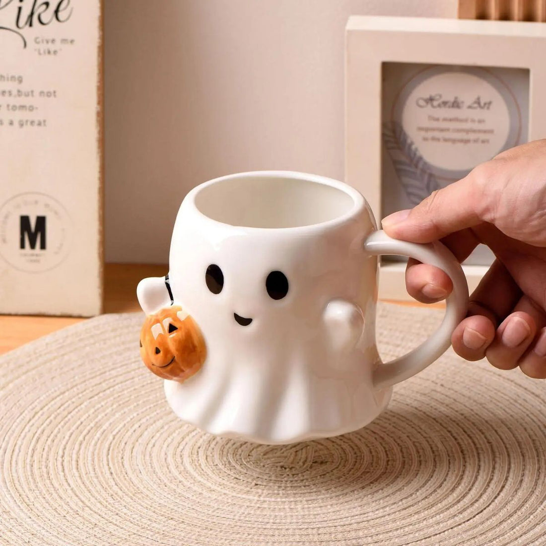 Ghost-shaped mug with a pumpkin halloween aesthetic