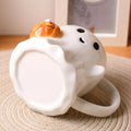 Ghost-shaped mug with a pumpkin halloween aesthetic