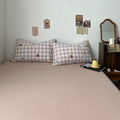 kawaii strawberry pastel checkered bedding with stars and strawberry print in dusty pink shades