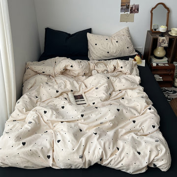 beige color toned aesthetic bedding set with black hearts and polka dot print duvet cover and pillowcases