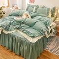 Pink ruffled bedding set with white frill trim, including a duvet cover, pillowcases, and bed skirt, in a soft and feminine coquette aesthetic