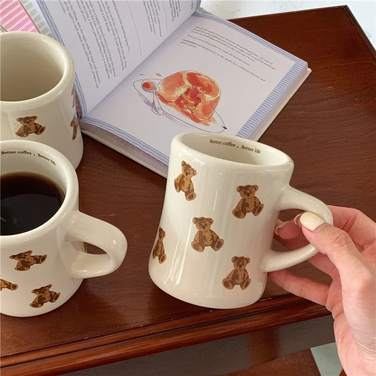 beige mug with teddy bear pattern on a white background