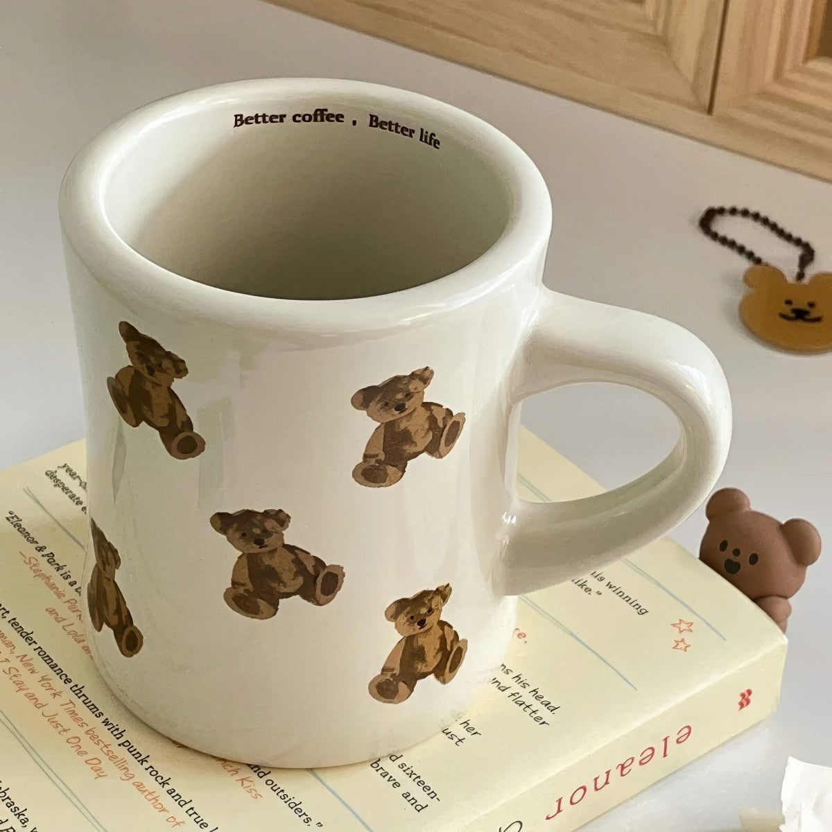 beige mug with teddy bear pattern on a white background