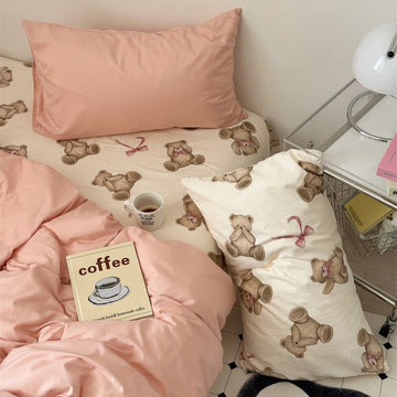 Teddy bear patterned bedding with dusty peachy pillow cases and duvet cover