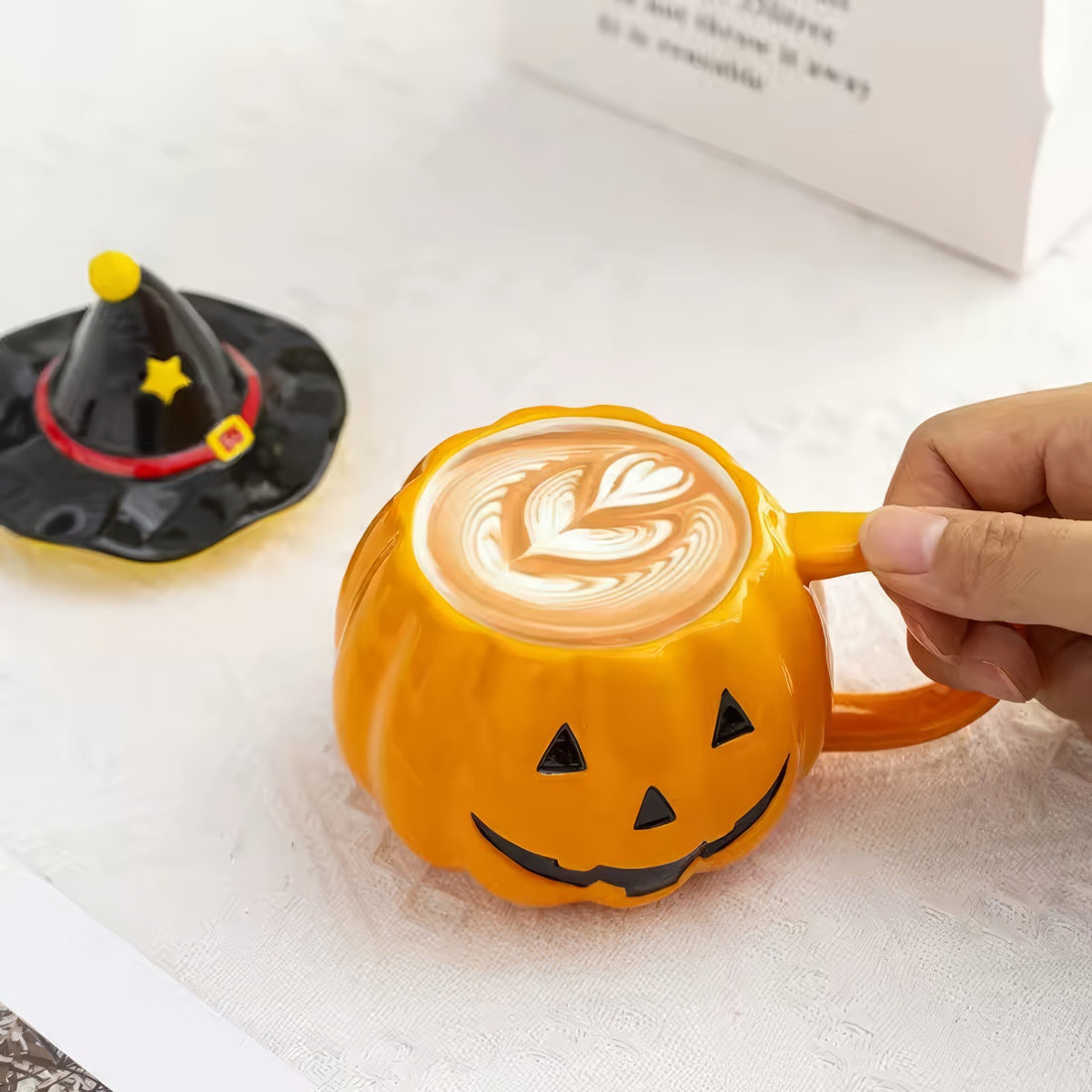 Pumpkin-shaped mug with witch hat lid halloween aesthetic