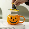 Pumpkin-shaped mug with witch hat lid halloween aesthetic