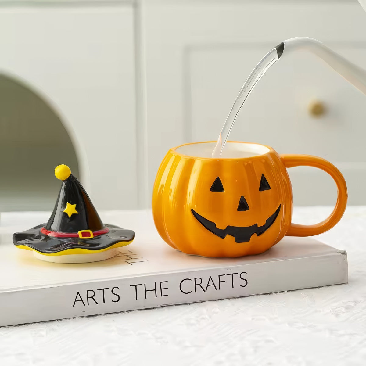 Pumpkin-shaped mug with witch hat lid halloween aesthetic