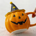 Pumpkin-shaped mug with witch hat lid halloween aesthetic