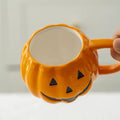 Pumpkin-shaped mug with witch hat lid halloween aesthetic