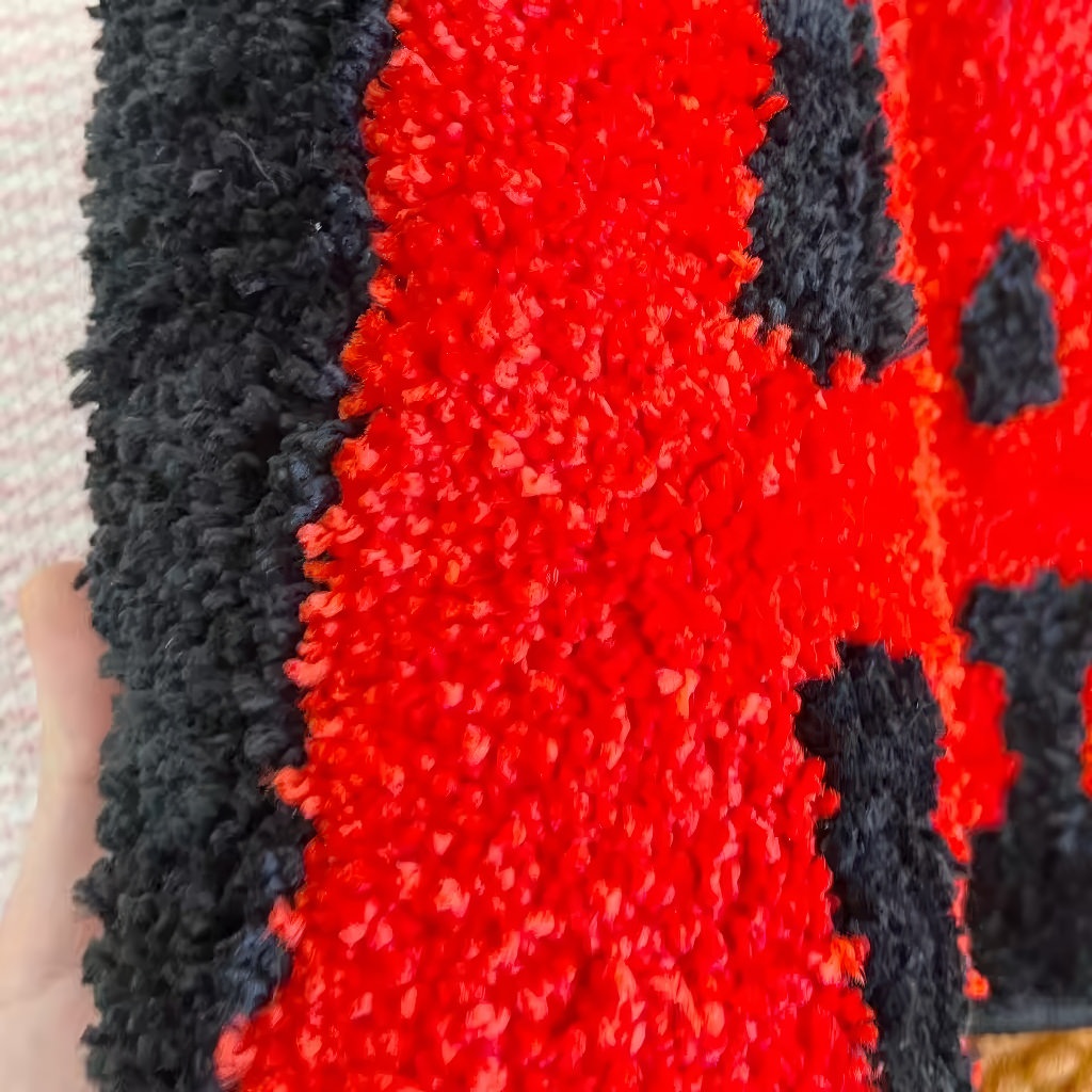 red all cash bright and contrast tufted accent rug in red