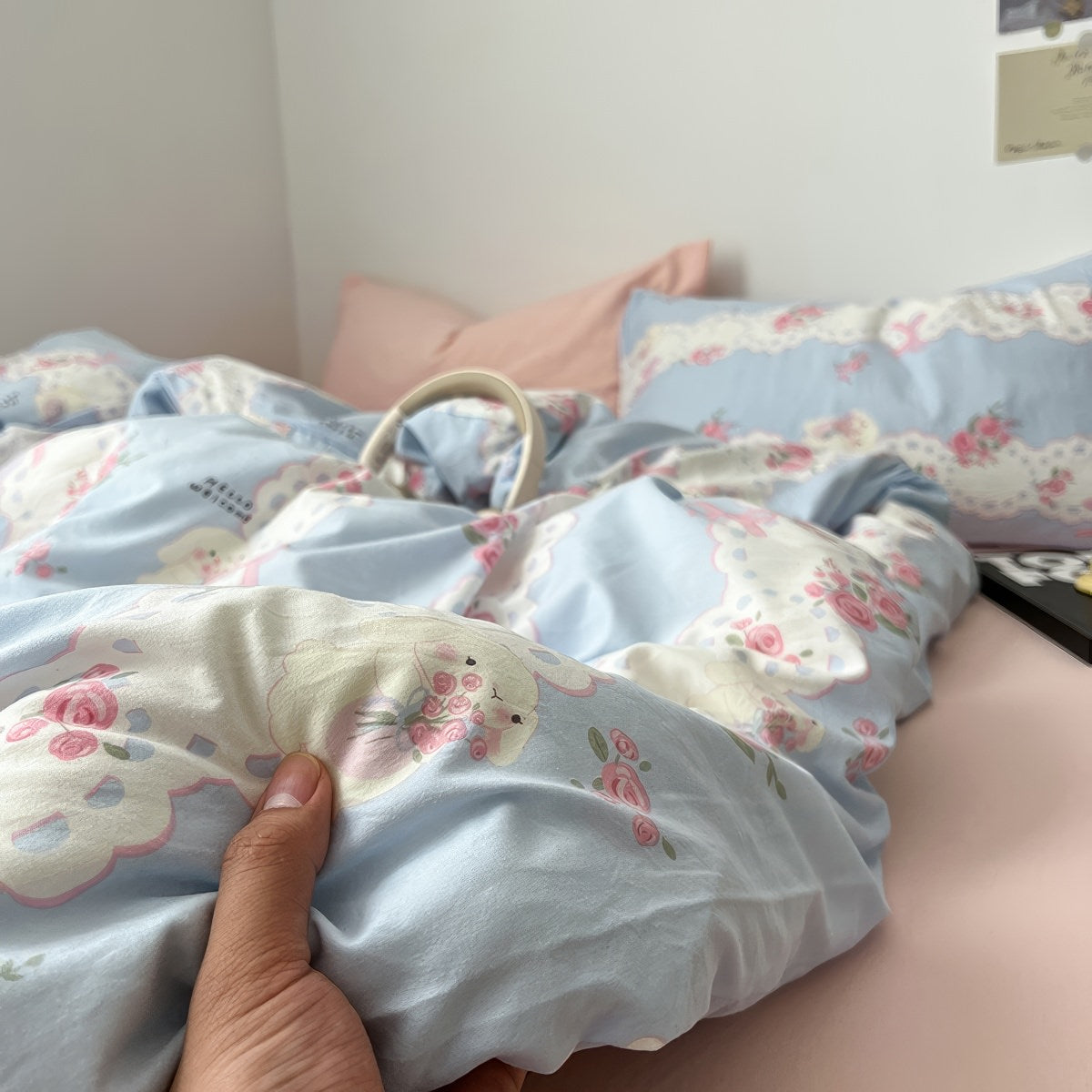 coquette aesthetic pale blue and pink bedding set with a print of cute laces, bows and pink roses