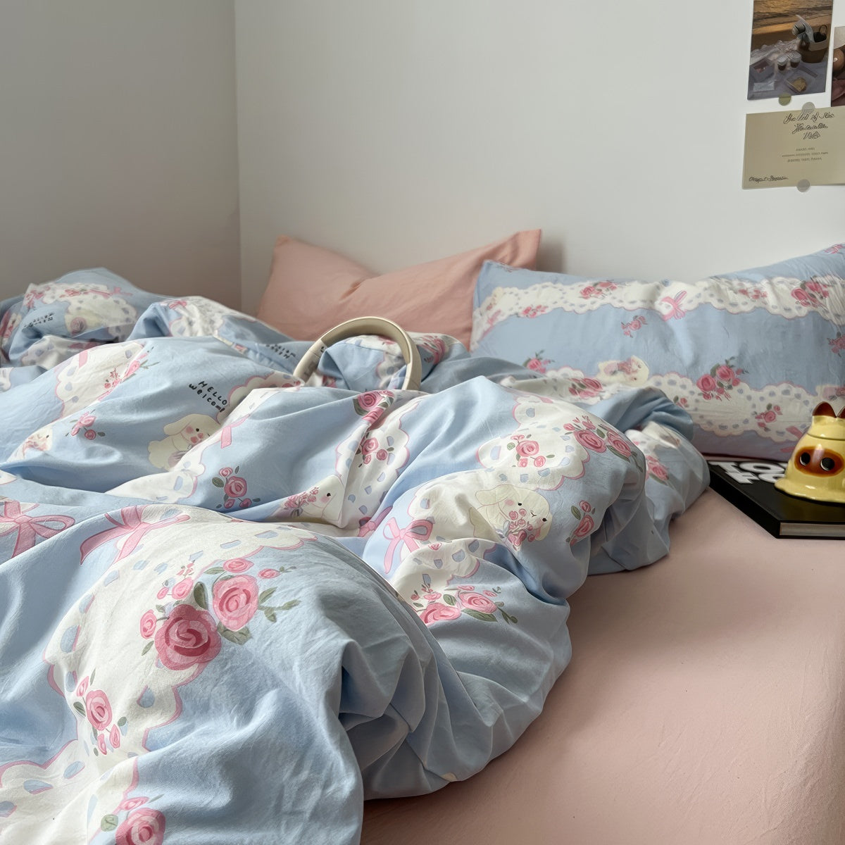 coquette aesthetic pale blue and pink bedding set with a print of cute laces, bows and pink roses