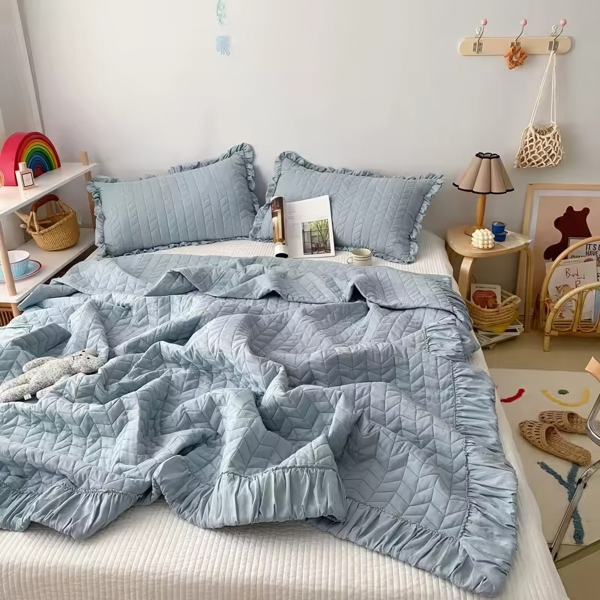 Ruffled summer quilt set with chevron stitching and ruffle trim, available in pastel and neutral colors