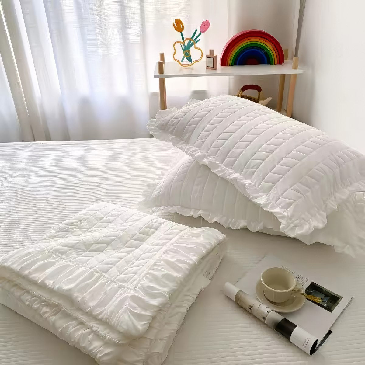 Ruffled summer quilt set with chevron stitching and ruffle trim, available in pastel and neutral colors