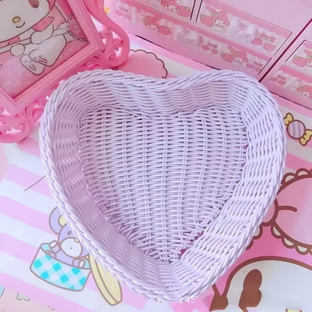 Heart-shaped pastel woven baskets in pink, mint, and lavender used for cute storage and desk organization.