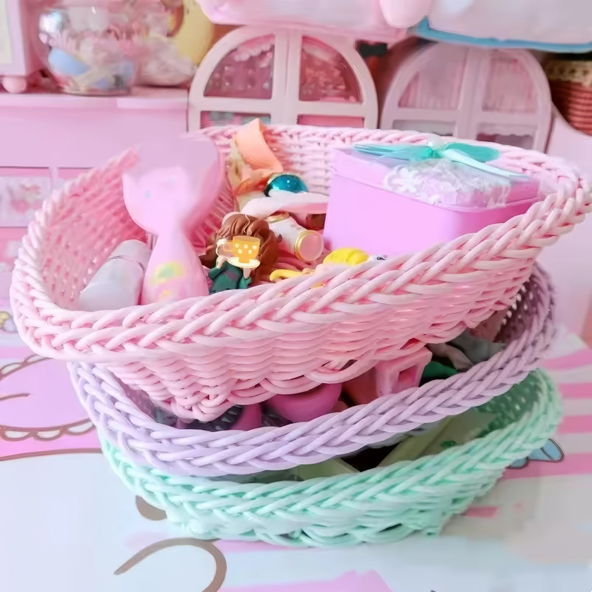Heart-shaped pastel woven baskets in pink, mint, and lavender used for cute storage and desk organization.
