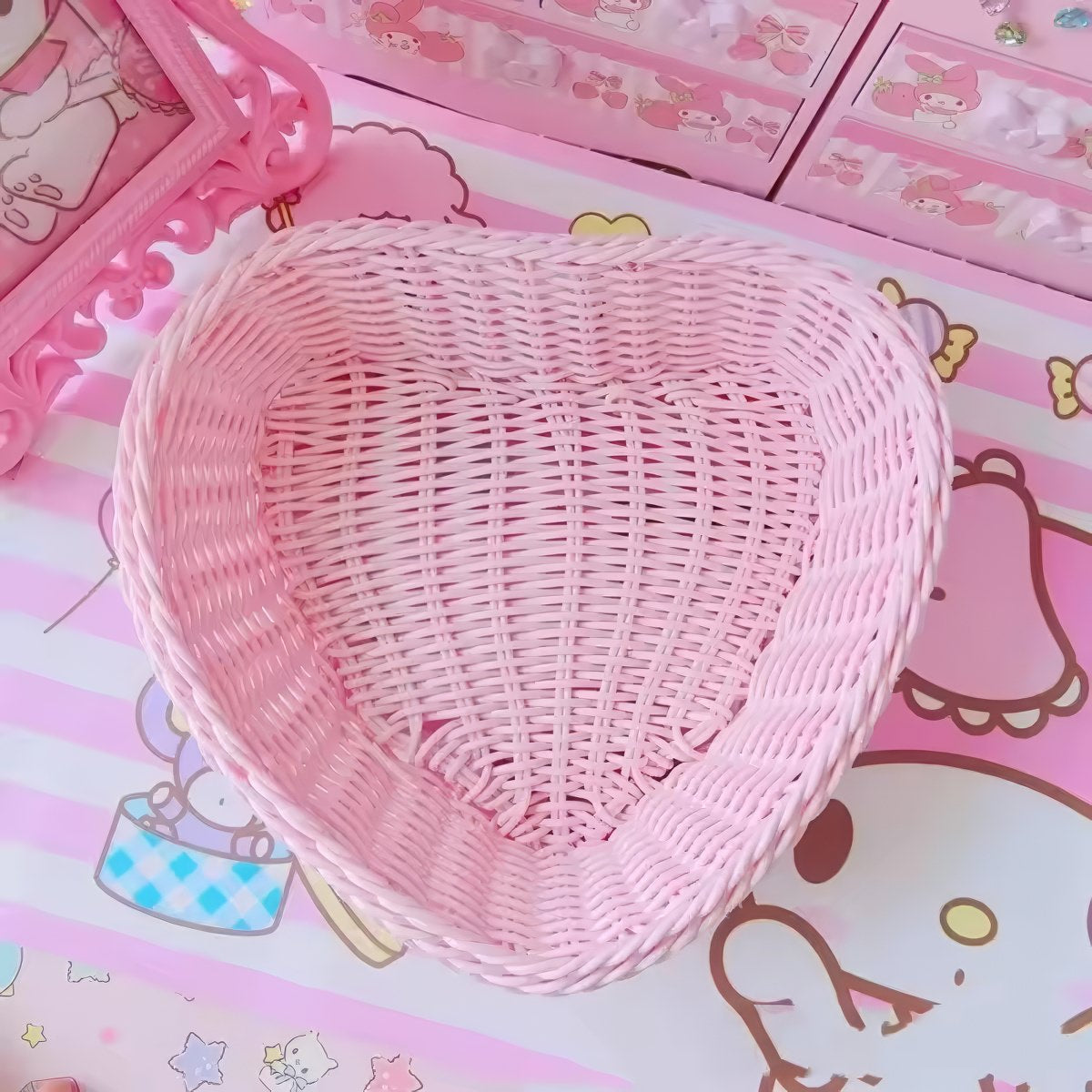 Heart-shaped pastel woven baskets in pink, mint, and lavender used for cute storage and desk organization.
