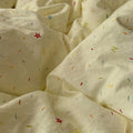 yellow creamy pastel bedding set with colorful sprinkles print pattern