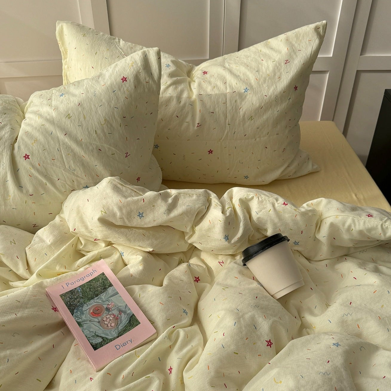 yellow creamy pastel bedding set with colorful sprinkles print pattern