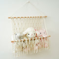 macrame wall hanging storage pocket for books and toys roomtery
