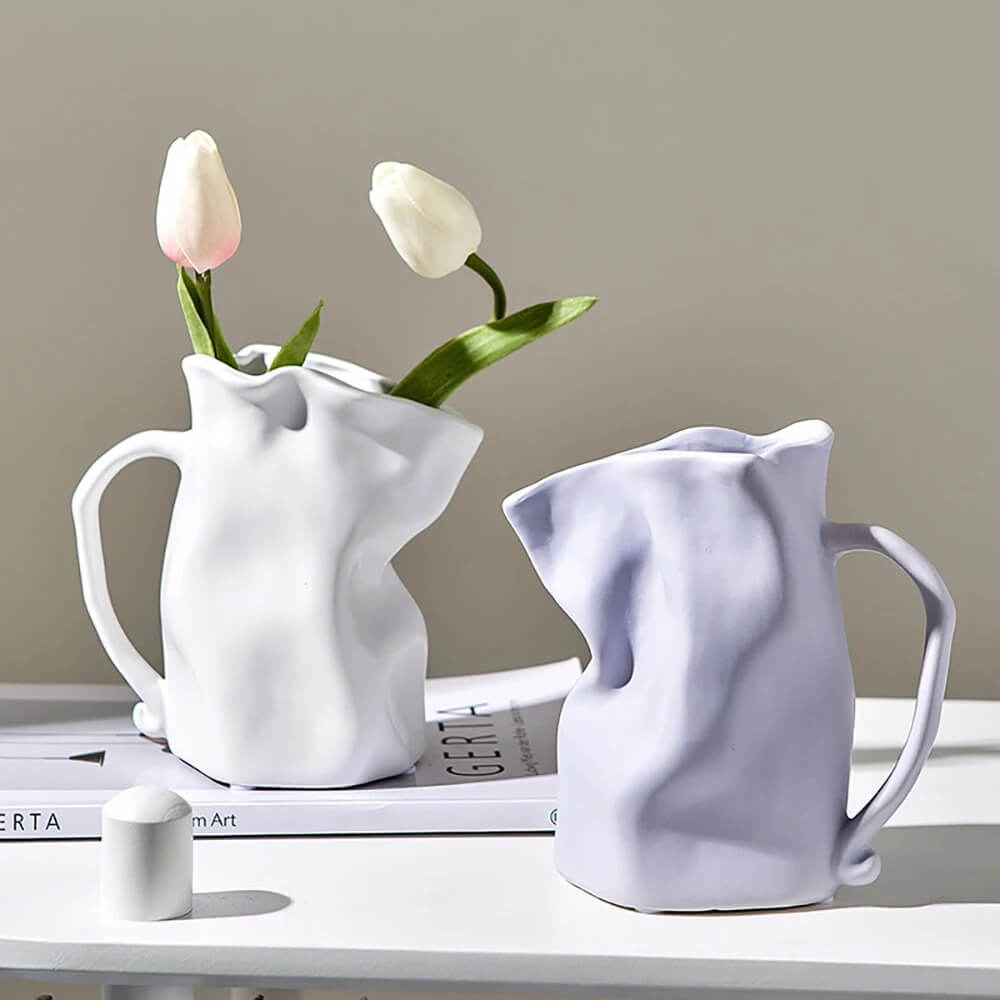 http://roomtery.com/cdn/shop/products/minimalit-aesthetic-crumple-tyle-mug-shaped-ceramic-vase-roomtery5.jpg?v=1679655961