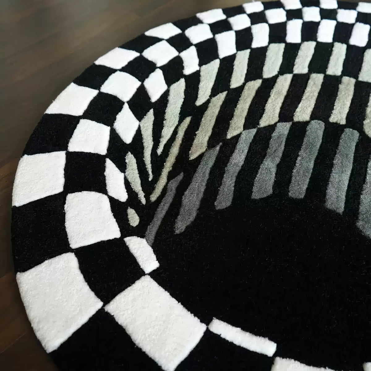 black and whiite 3d effect illusion rug looking like a hole or tunnel with checkered pattern