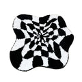 black and white checkered irregular blob 3d illusion tufted accent rug
