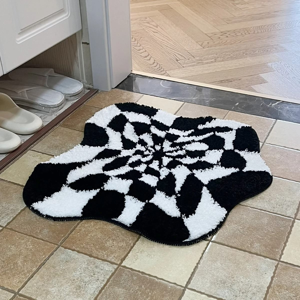 black and white checkered irregular blob 3d illusion tufted accent rug