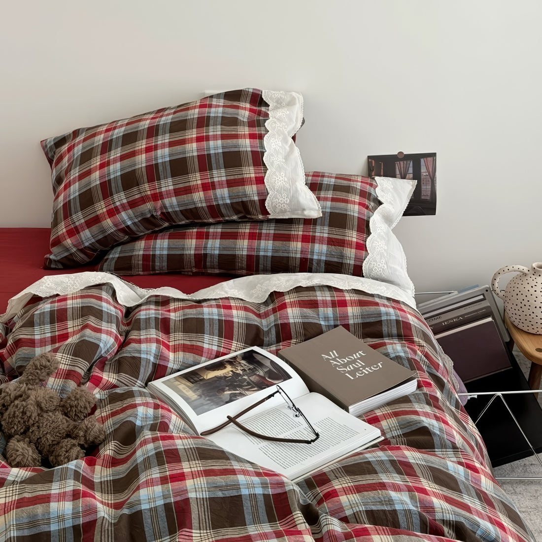 Bavarian plaid bedding set with red and brown checks and white lace ruffled trim on duvet cover and pillowcases.