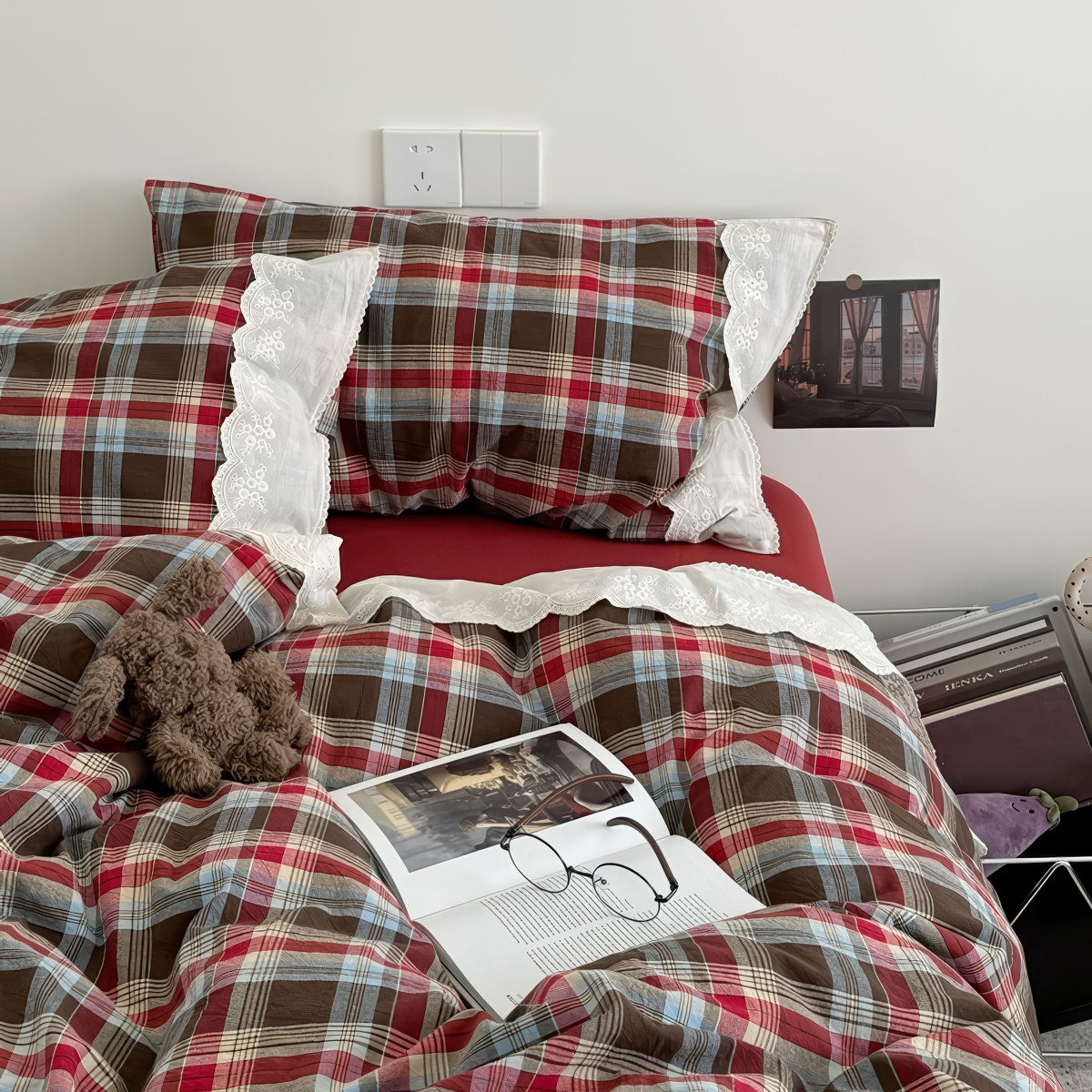 Bavarian plaid bedding set with red and brown checks and white lace ruffled trim on duvet cover and pillowcases.
