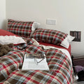 Bavarian plaid bedding set with red and brown checks and white lace ruffled trim on duvet cover and pillowcases.