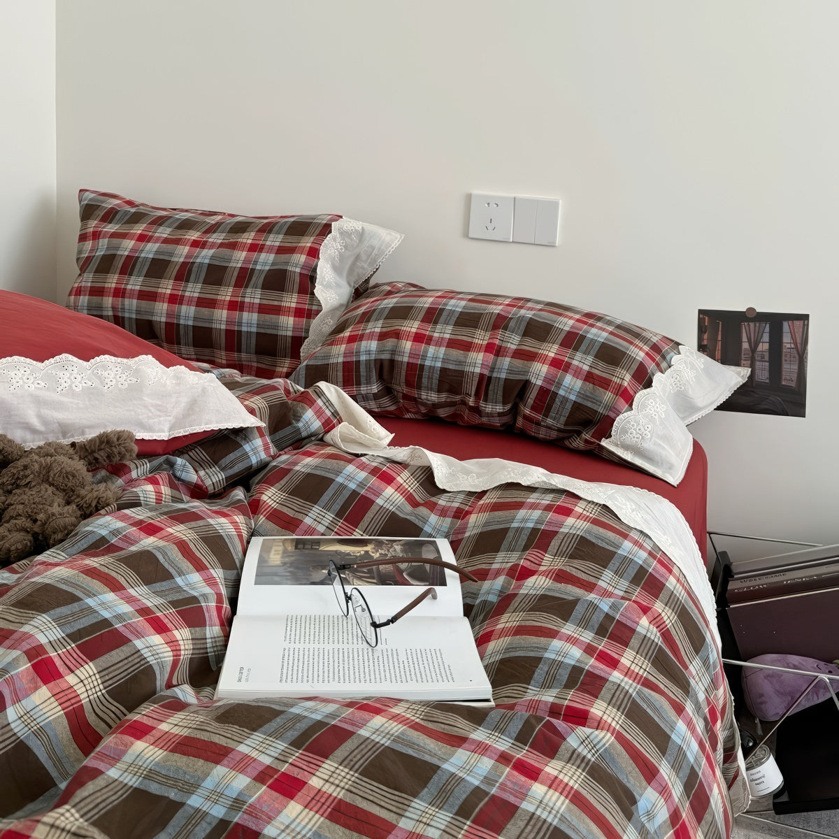 Bavarian plaid bedding set with red and brown checks and white lace ruffled trim on duvet cover and pillowcases.