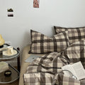 Neutral-toned gingham check bedding set in brown and beige with pillows and cozy duvet cover 