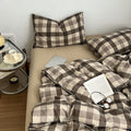 Neutral-toned gingham check bedding set in brown and beige with pillows and cozy duvet cover 