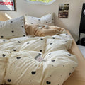 light beige duvet cover with black hearts pattern print with matching sham set bedding roomtery