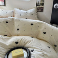 light beige duvet cover with black hearts pattern print with matching sham set bedding roomtery