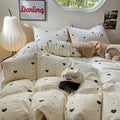 light beige duvet cover with black hearts pattern print with matching sham set bedding roomtery